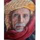 An oil painting on canvas of a man with a red shawl by the renowned Yemeni artist Adnan Juman.