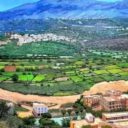 acrylic painting titled “Wadi Bana”, measuring 160 × 325 cm, by the visual artist Redfan Al-Mohammadi.